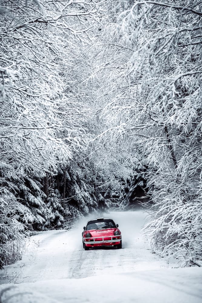 Red Convertible Snowy Road by Adrian — canvas wall art