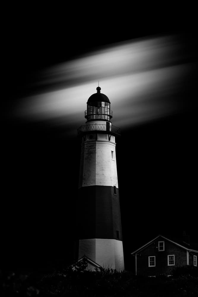 Solitary Night Lighthouse by Jackson Carvalho — canvas wall art