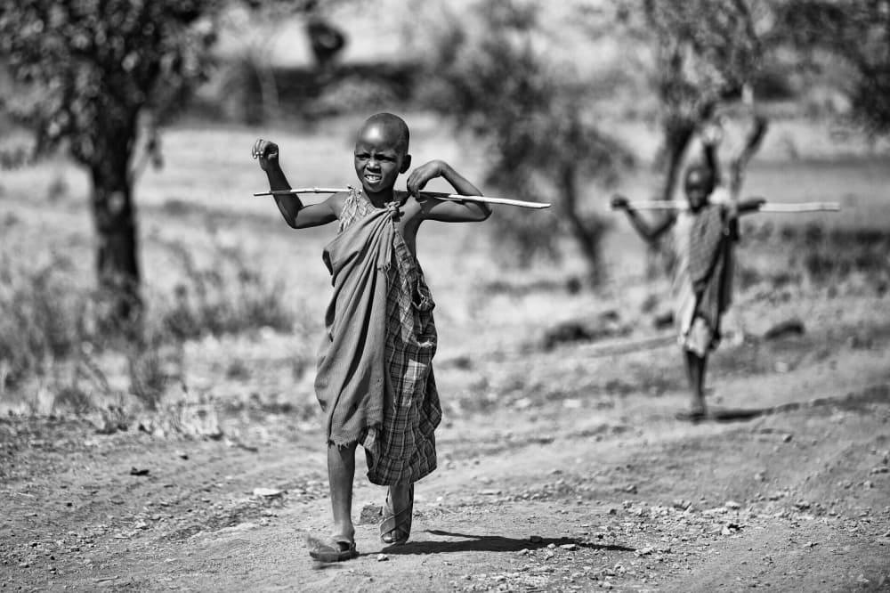 Joyful African Youth Walking by Goran Jovic — canvas wall art