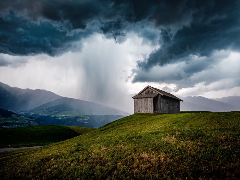 Storm Over Mountain Barn by Arne Jansen — canvas wall art