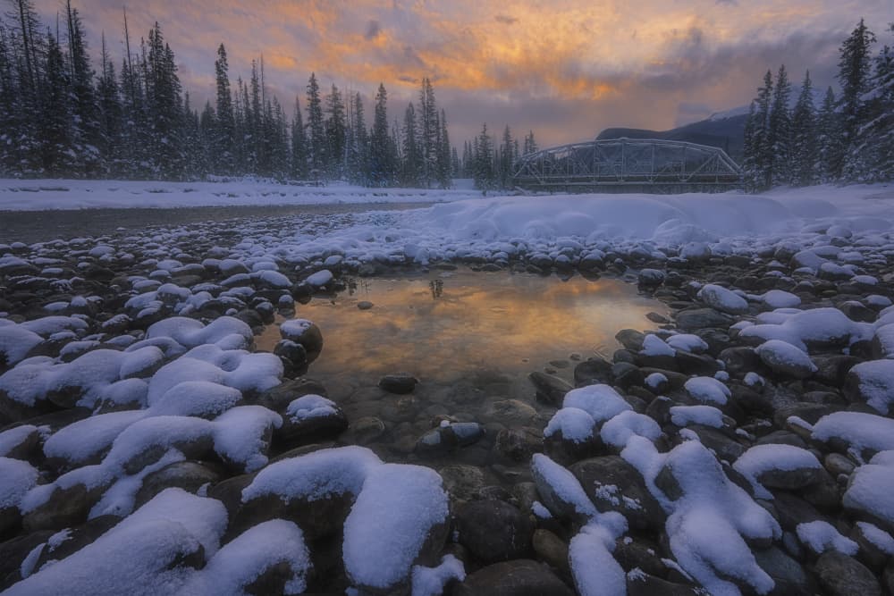 Winter River Bridge Glow by Lydia Jacobs — canvas wall art