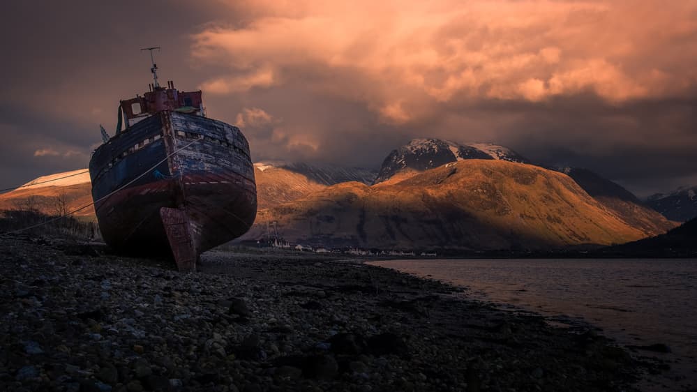 Sunset Shipwreck Mountains by Karen Deakin — canvas wall art