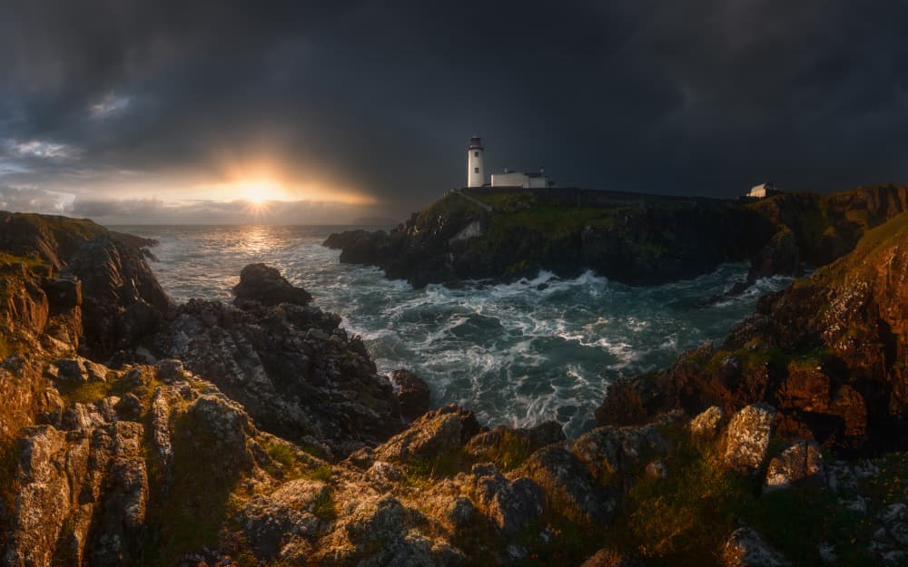 Stormy Lighthouse Sunset by Tomasz Rojek — canvas wall art