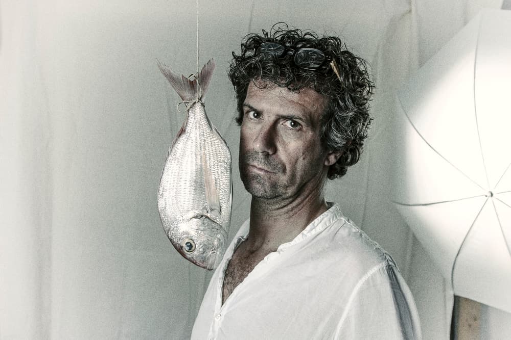 Man and Suspended Fish by Marc Limbach — canvas wall art