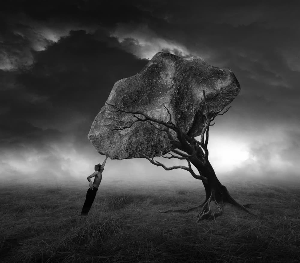 Man Pushing Heavy Rock by Hari Sulistiawan — canvas wall art