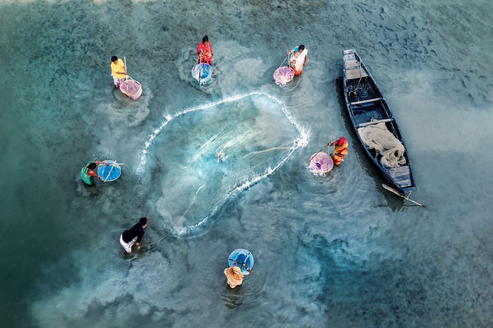 Women Fishing River by Prithul Das — canvas wall art