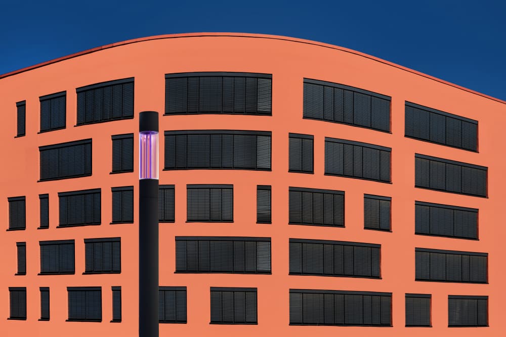 Vibrant Orange Building by Hans-Wolfgang Hawerkamp — canvas wall art