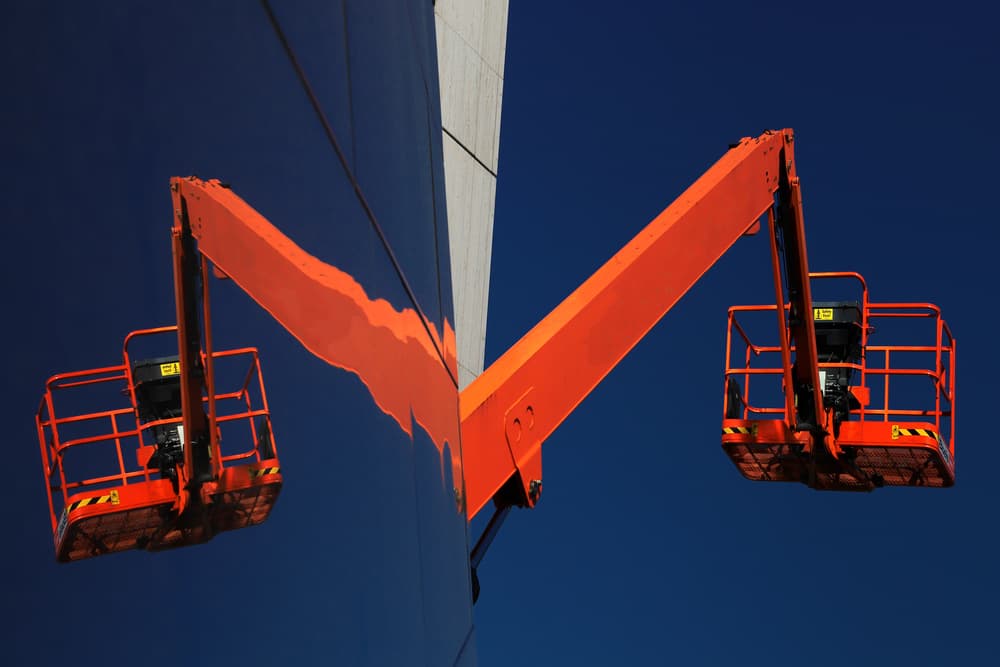 Orange Boom Lifts Symmetry by Hans-Wolfgang Hawerkamp — canvas wall art