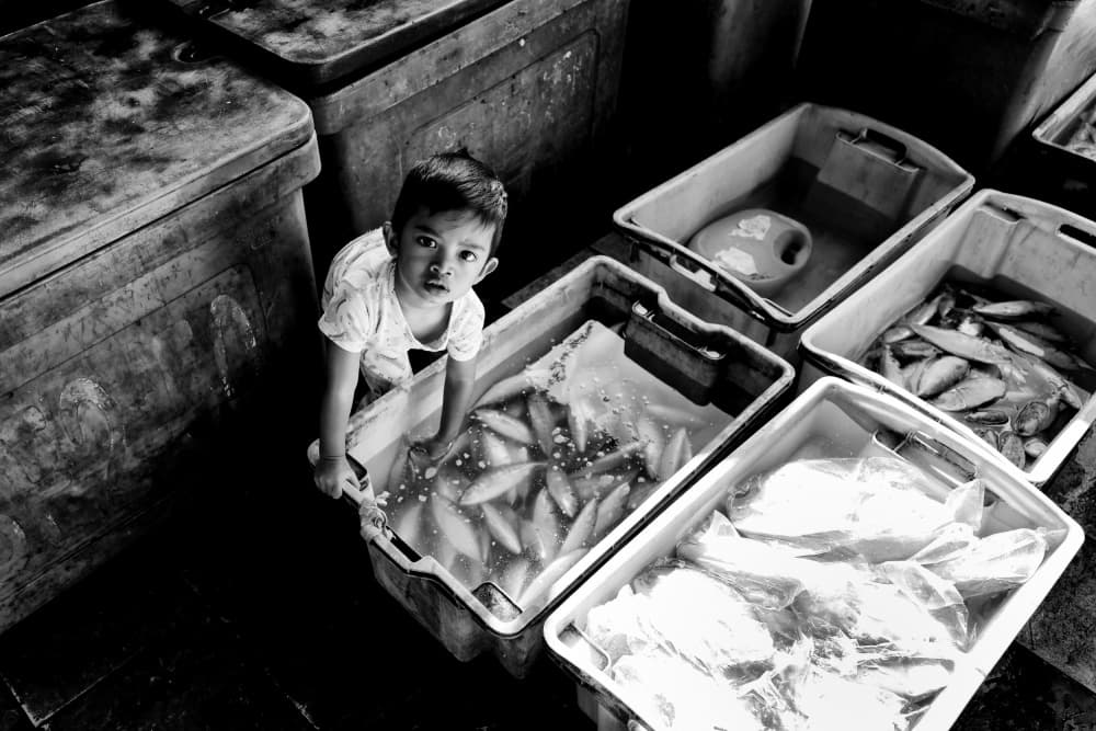 Market Boy's Gaze by Kieron Long — canvas wall art