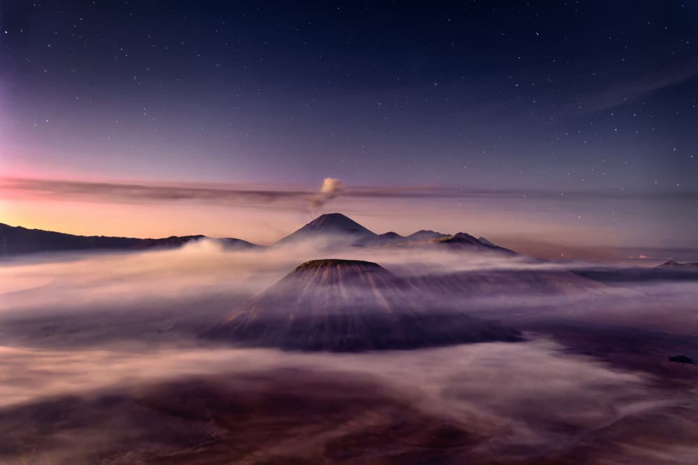 Volcanoes Under Starry Sky by Ricardo Gayan — canvas wall art