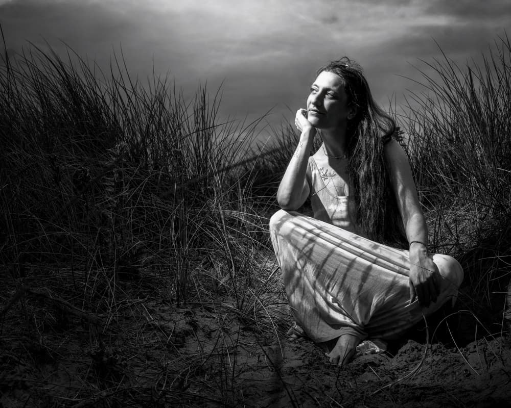 Thoughtful Woman in Dunes by Lee Kershaw — canvas wall art