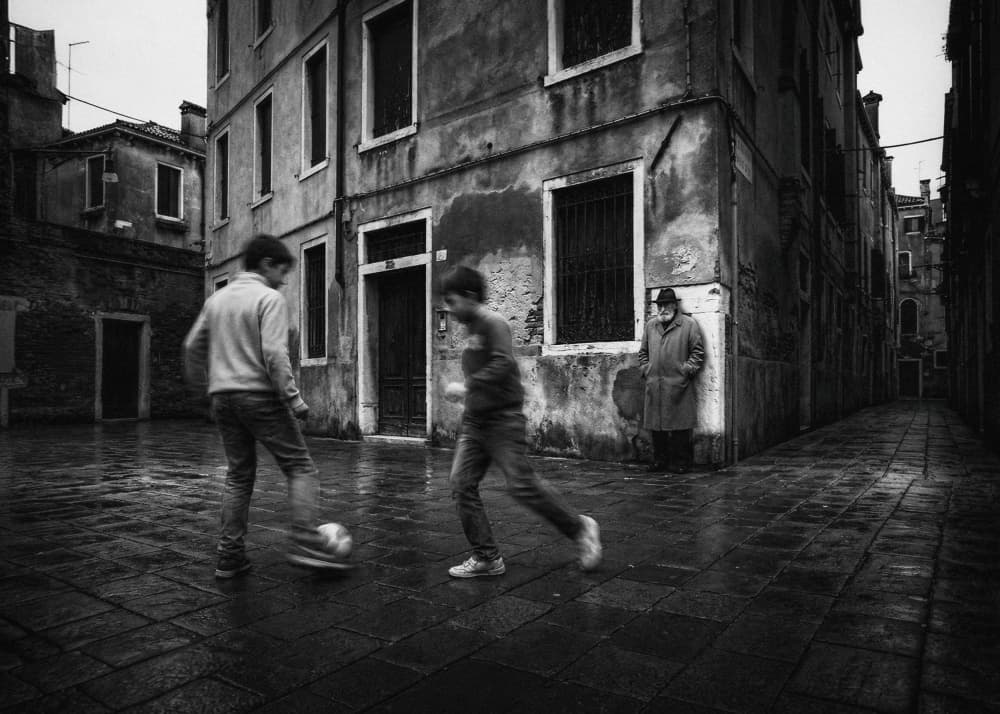 Boys Playing Rainy Street by Holger Droste — canvas wall art