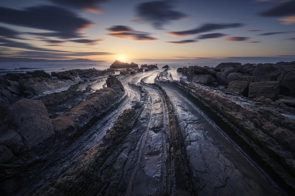 Coastal Rock Formations Sunrise by Jorge Ruiz Dueso — canvas wall art