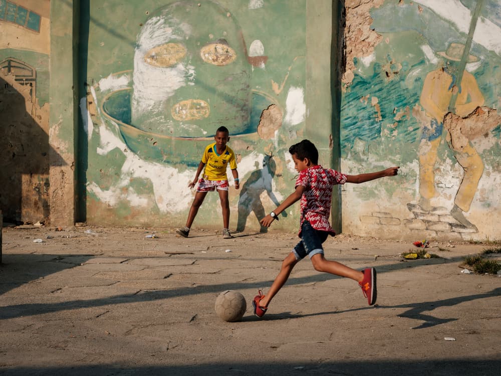 Kids Playing Street Soccer by Andy Bauer — canvas wall art