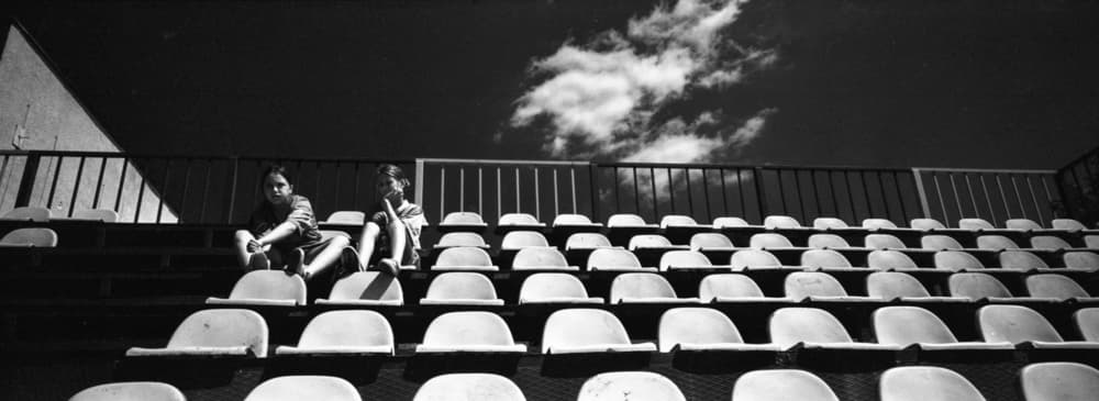 Children in Empty Stands by Sorin Vidis — canvas wall art