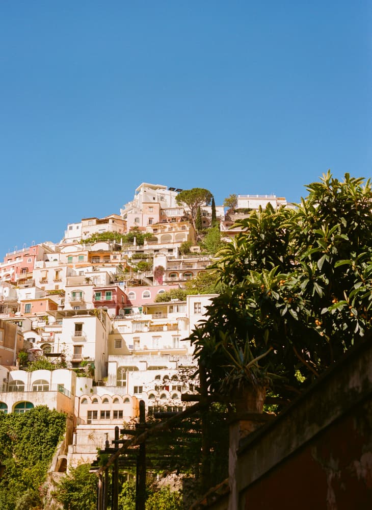 Colorful Coastal Village by Bethany Young — canvas wall art