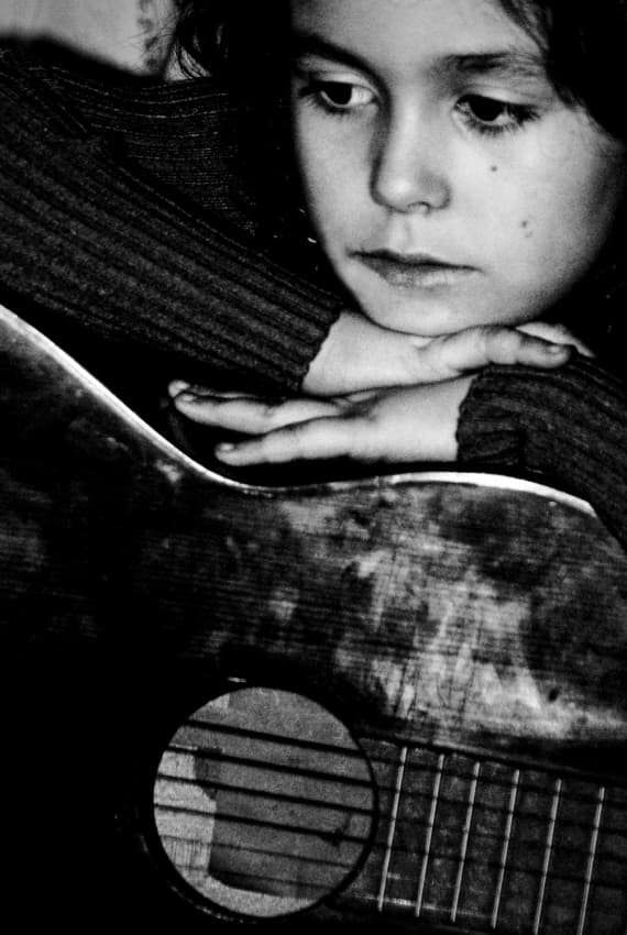 Pensive Girl With Guitar by Codrin Lupei — canvas wall art