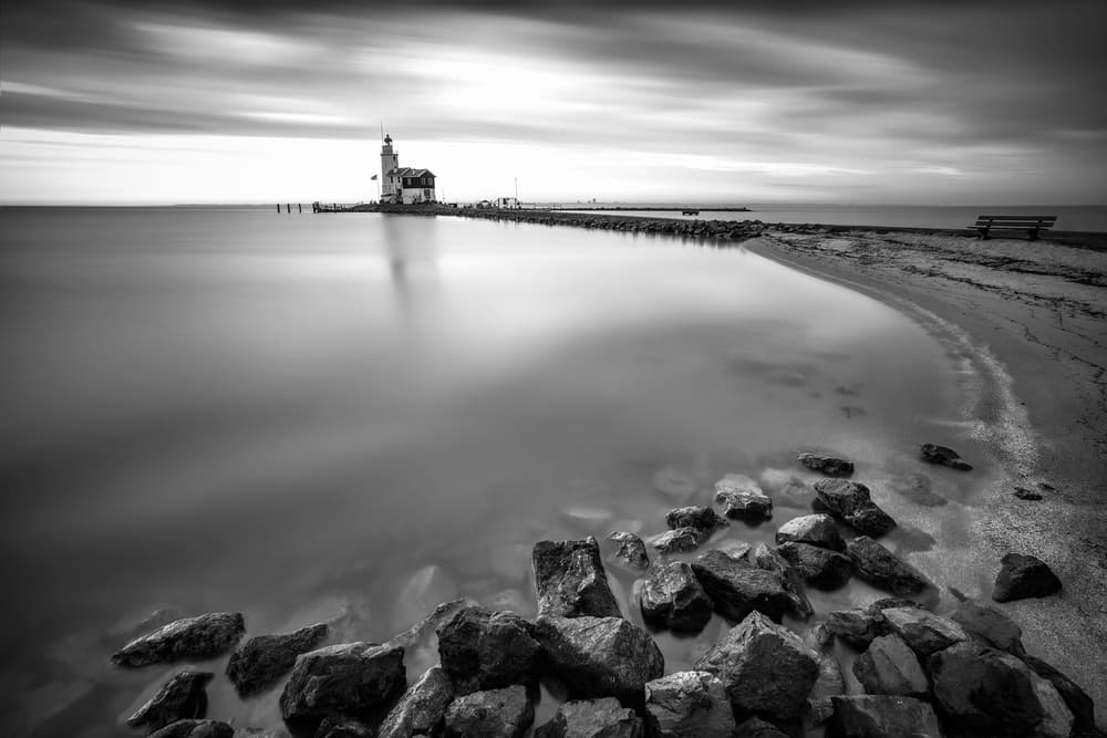 Tranquil Lighthouse Seascape by Krzysztof Mierzejewski — canvas wall art