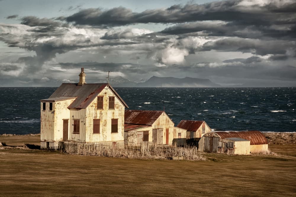 Weathered Coastal Home by Þorsteinn H. Ingibergsson — canvas wall art