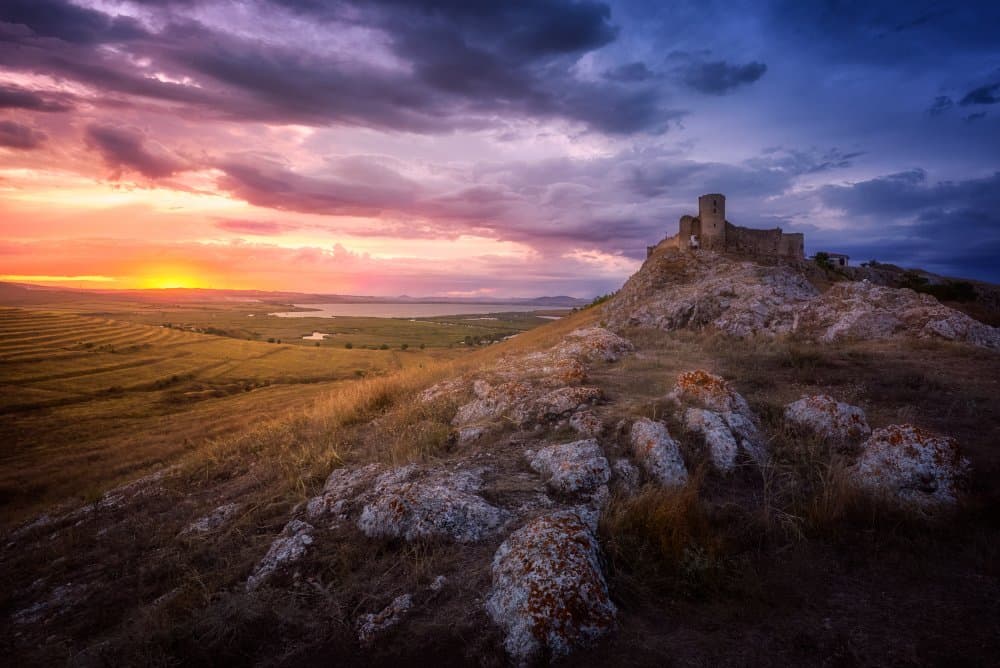 Dramatic Castle Sunset by Anghel Rusu — canvas wall art