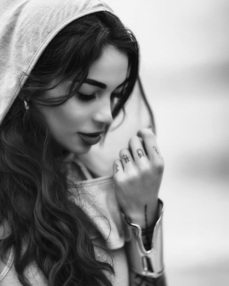 Pensive Woman in Hoodie by Vasil Nanev — canvas wall art