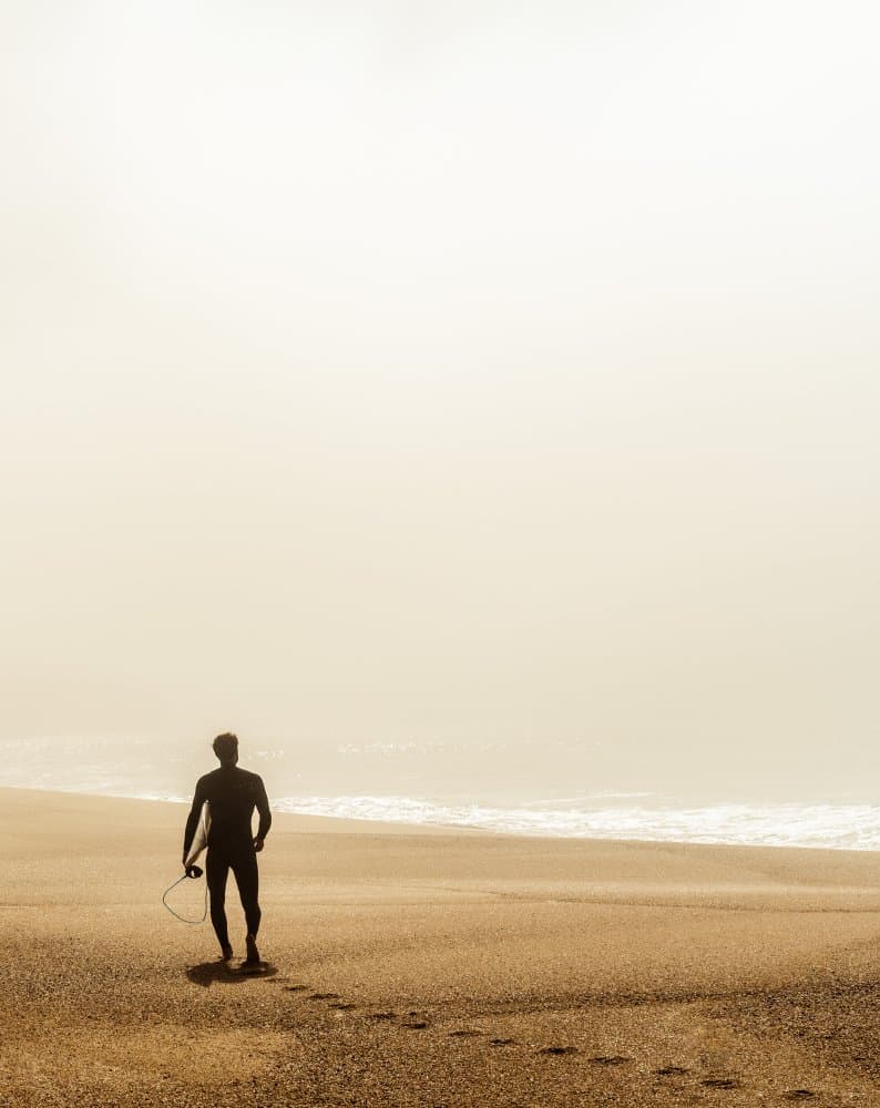 Misty Golden Hour Surfer by Dieter Reichelt — canvas wall art