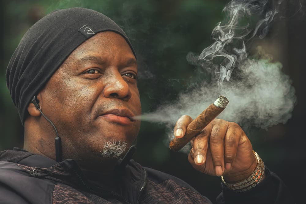 Contemplative Man Smoking Cigar by Davorin Baloh — canvas wall art