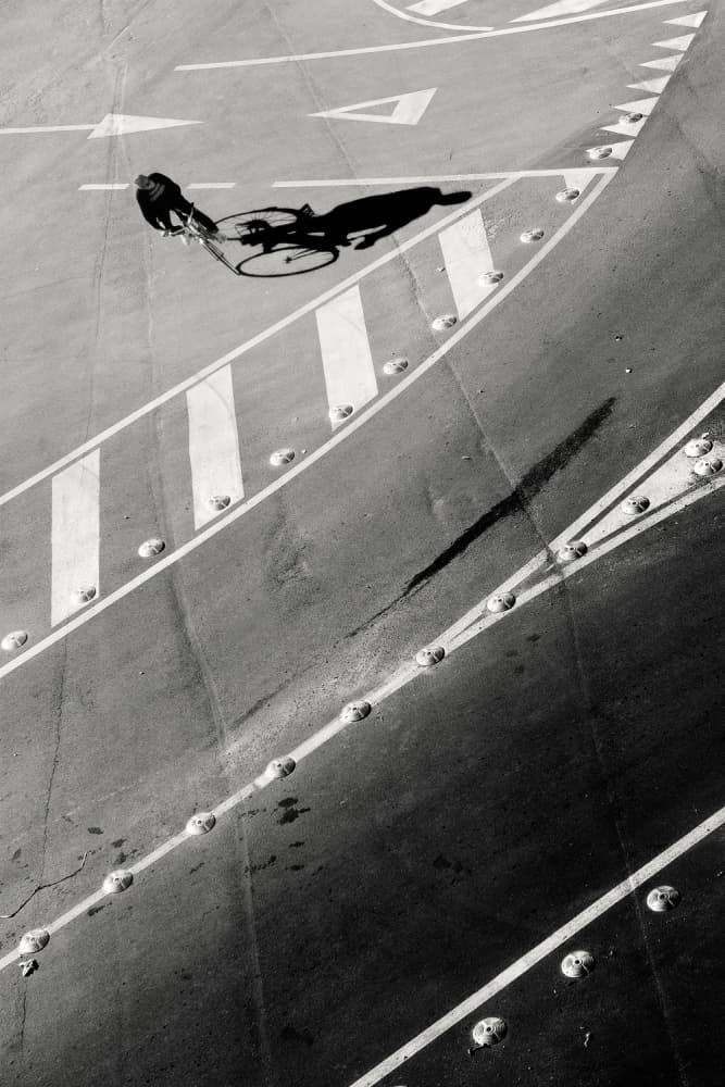 Cyclist and Shadow Play by Pietrino Di Sebastiano — canvas wall art