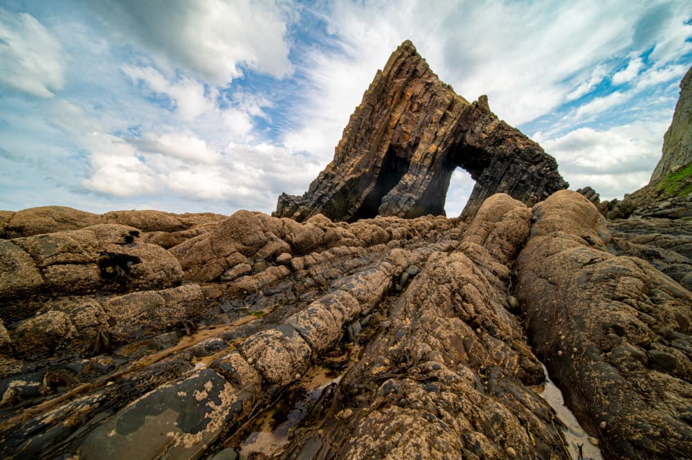 Rugged Coastal Arch by Jean Vandijck — canvas wall art