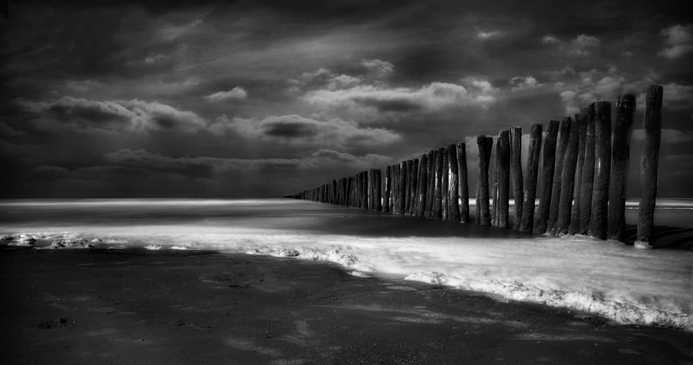 Moody Ocean Pilings by Yvette Depaepe — canvas wall art