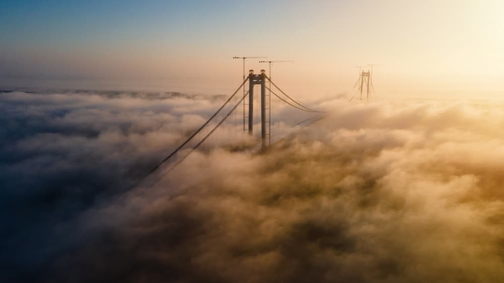 Golden Bridge Above Fog by Sorin Mosescu — canvas wall art