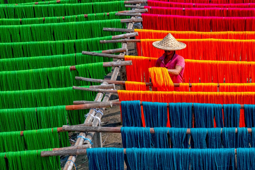 Vibrant Yarn Drying by Abhraneel Chakraborty — canvas wall art