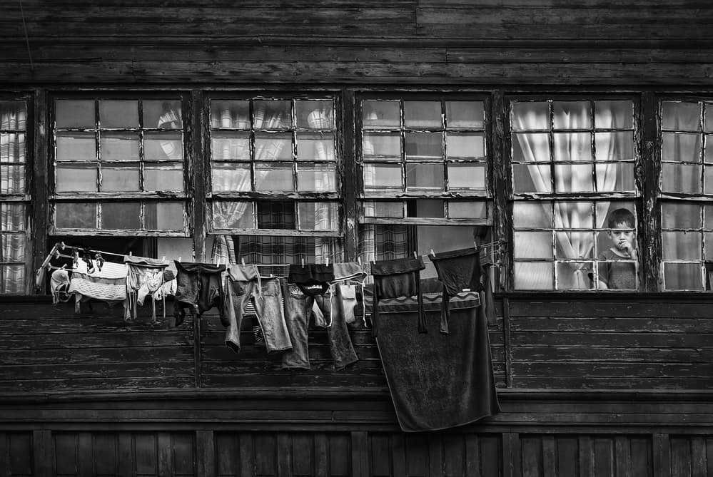 Boy in Old Window by Jose C. Lobato — canvas wall art