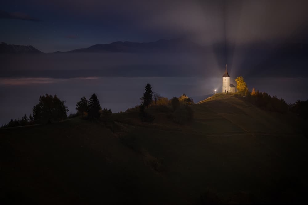 Glowing Hilltop Church at Night by Marian Kuric QEP — canvas wall art
