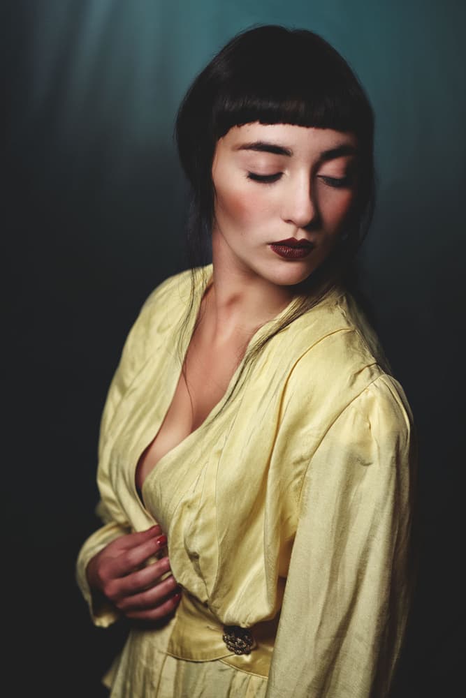 Pensive Woman in Yellow by Antonella Renzulli — canvas wall art