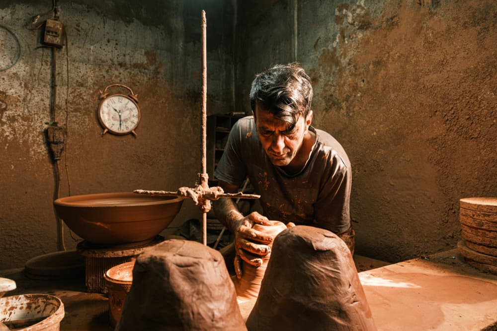 Potter at Work by Ali Ayer — canvas wall art