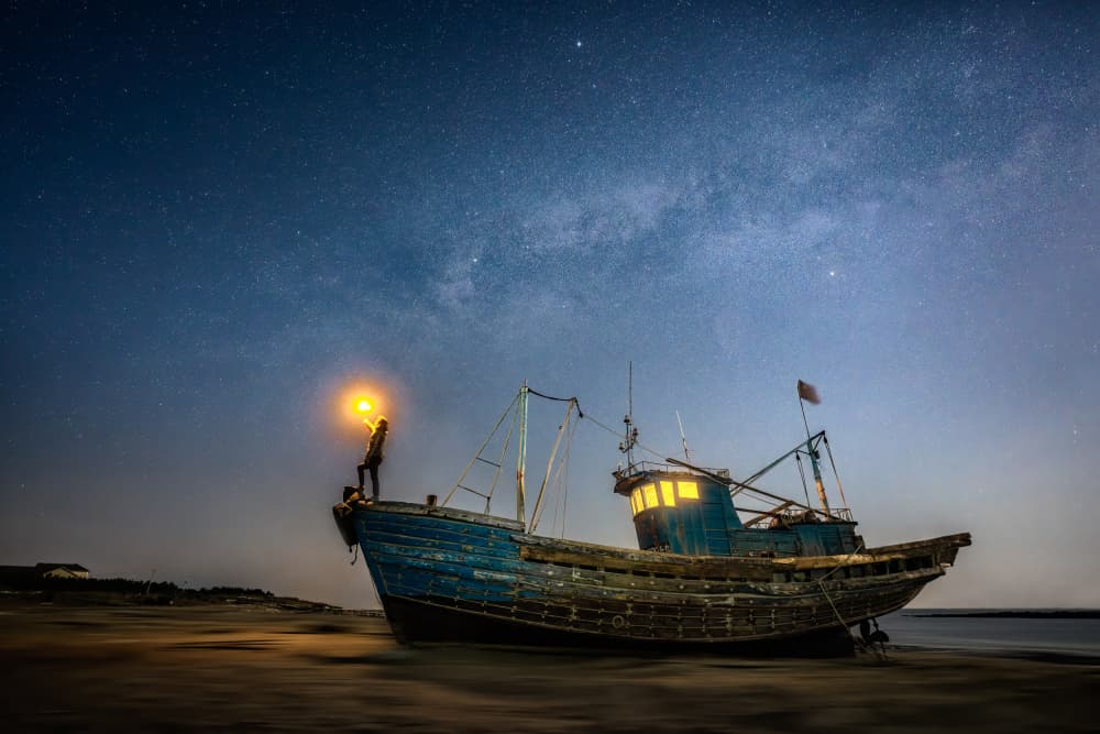 Stargazer on Abandoned Boat by Yuan Cui — canvas wall art