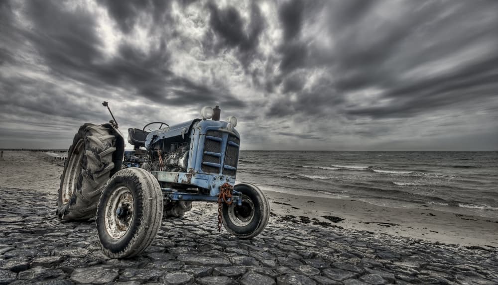 Old Tractor Stormy Beach by Leon — canvas wall art