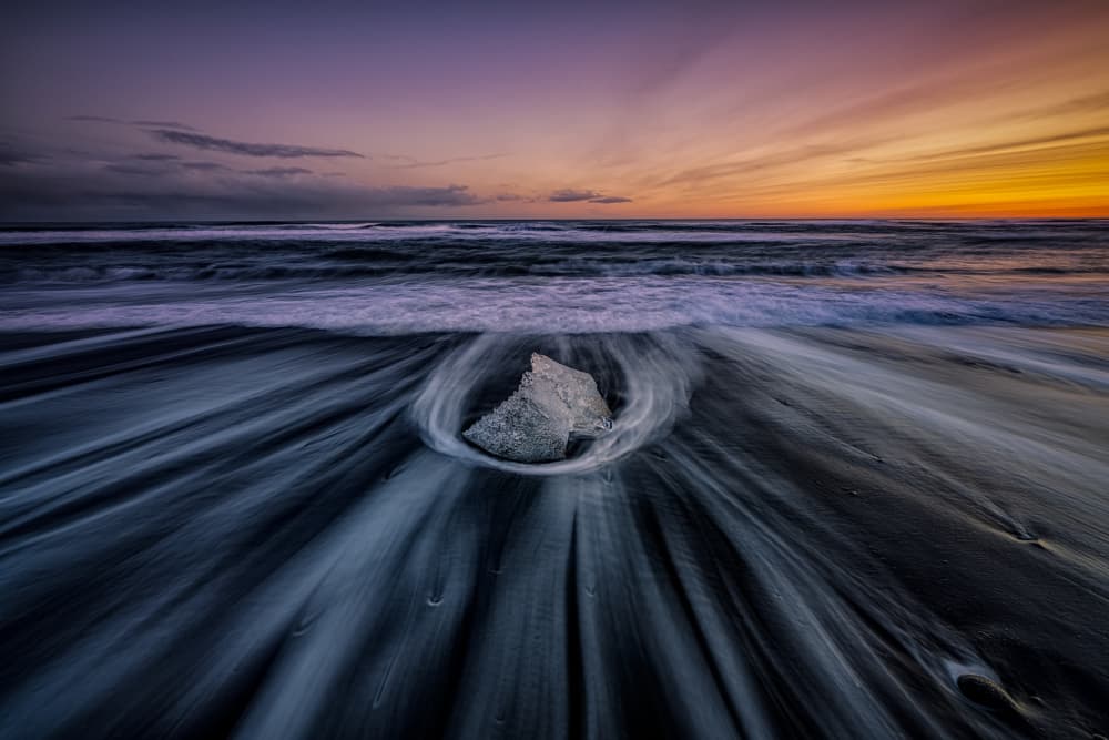 Dramatic Ice Beach Sunset by James Zhen Yu — canvas wall art
