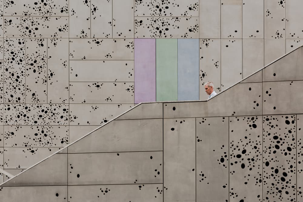 Man Ascending Modern Stairs by Jois Domont ( J.L.G.) — canvas wall art
