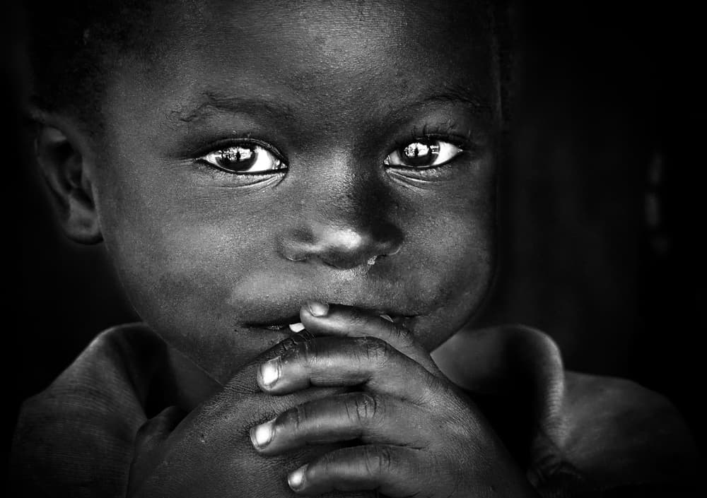 Solemn Child Portrait by Elena Molina — canvas wall art