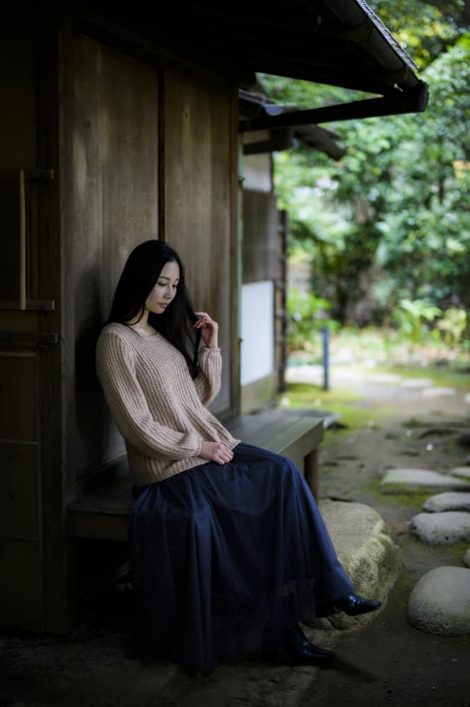 Thoughtful Woman in Garden by Yoshihisa Nemoto — canvas wall art