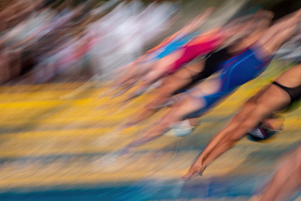 Swimmers Diving Into Motion by Milan Malovrh — canvas wall art