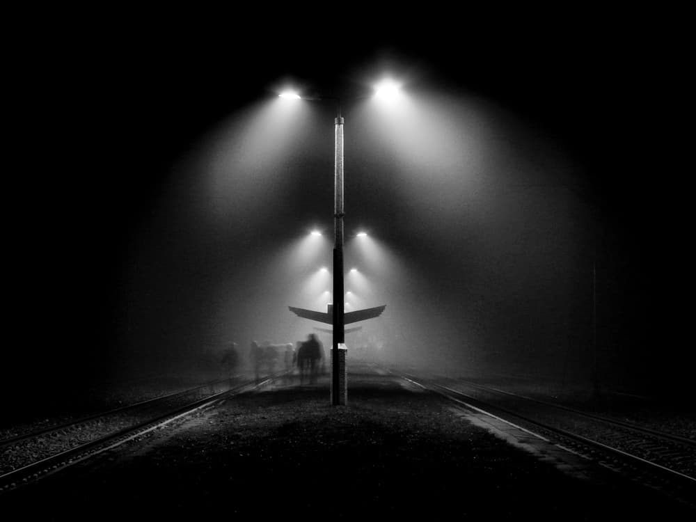 Foggy Night Train Tracks by Wojciech Pokora — canvas wall art