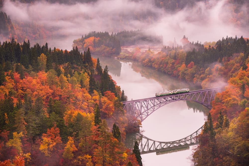 Vibrant Autumn Train Bridge by Kei Sasaki — canvas wall art