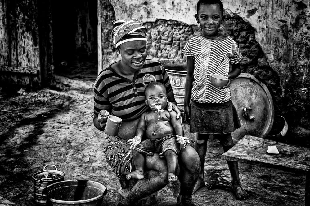 Loving Village Family by Joxe Inazio Kuesta Garmendia — canvas wall art