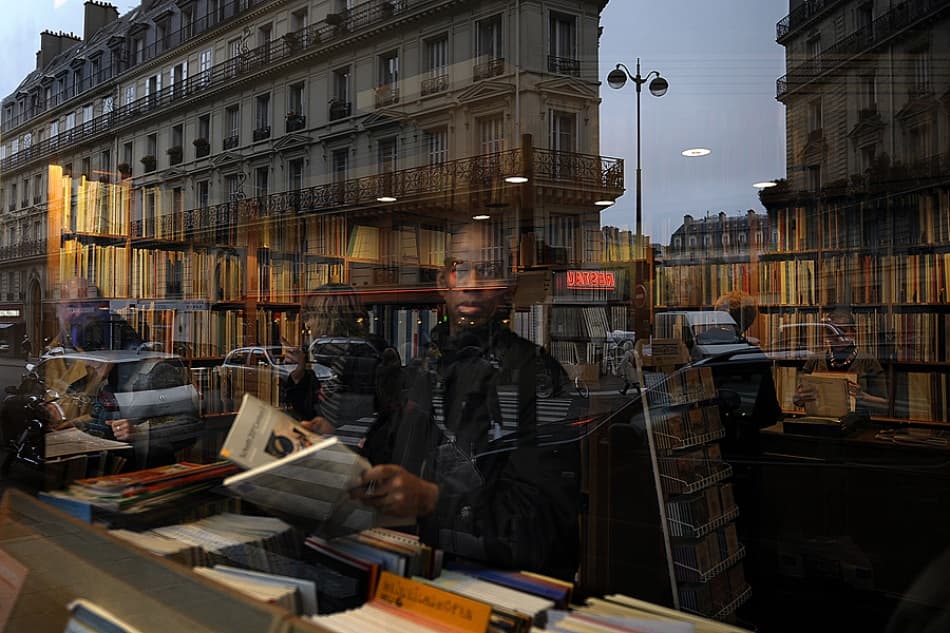 Parisian Bookstore Reflection by Jure Kravanja — canvas wall art
