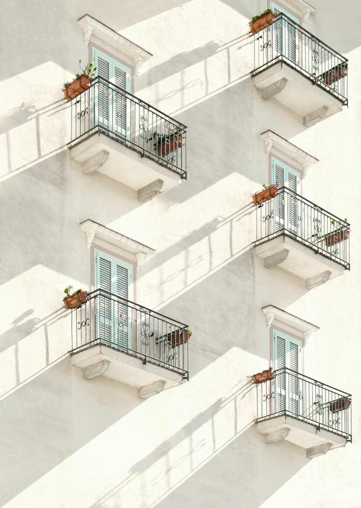 White Balconies Blue Shutters by Karin Kilb — canvas wall art