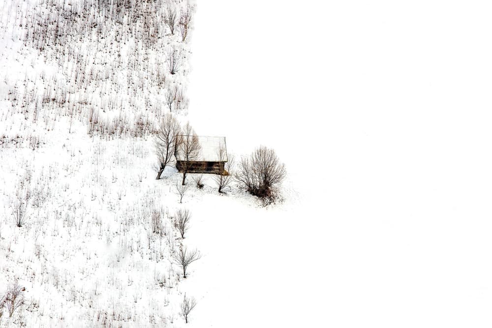 Isolated Winter Cabin by Faris Saieda — canvas wall art