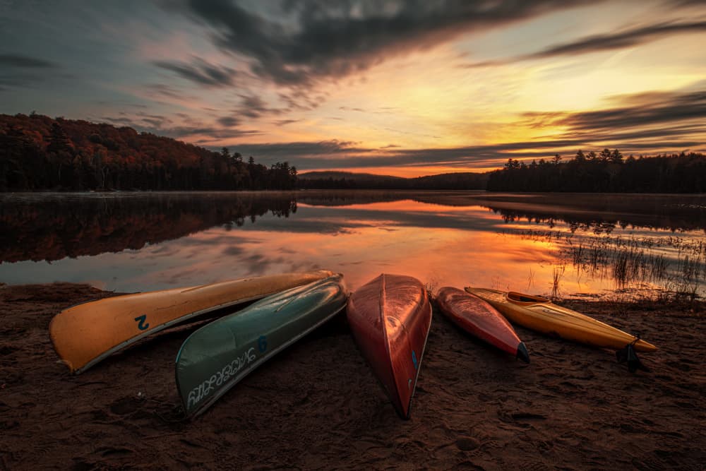 Canoes At Golden Sunset by Louie Luo — canvas wall art